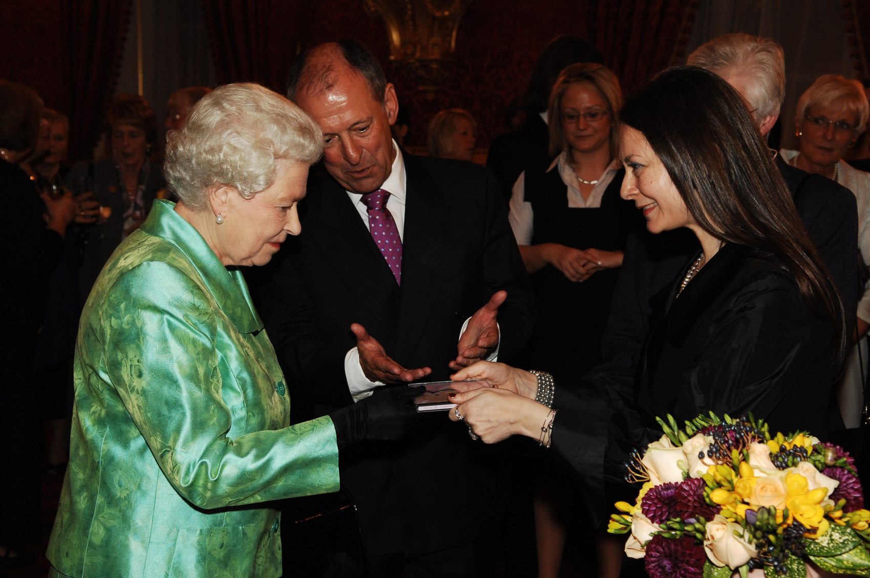 Dr. Olga Thomas presenting music to Her Majesty The Queen